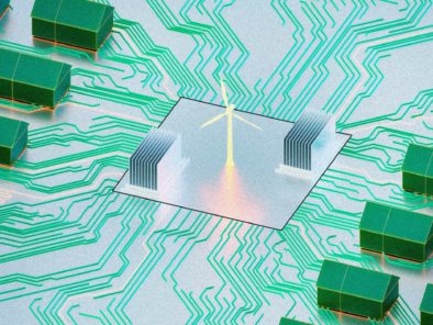 Illustration of a circuit board with a central chip featuring a wind turbine icon, surrounded by green microchips connected by green circuitry.