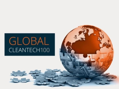 Image of a jigsaw puzzle globe partially assembled on a surface, with the text "Global Cleantech 100" beside it in orange and white.